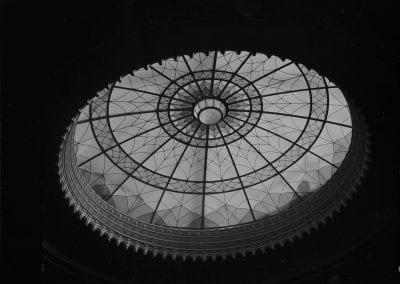 An old black and white photograph of an elaborate stained glass dome.